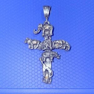 Silver cross with animals.